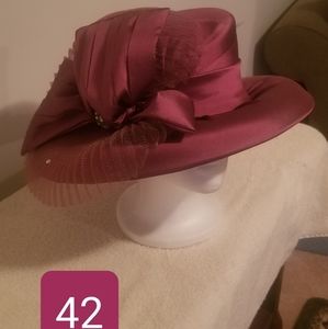 Rose colored hat w/ satin ribbon and netting.